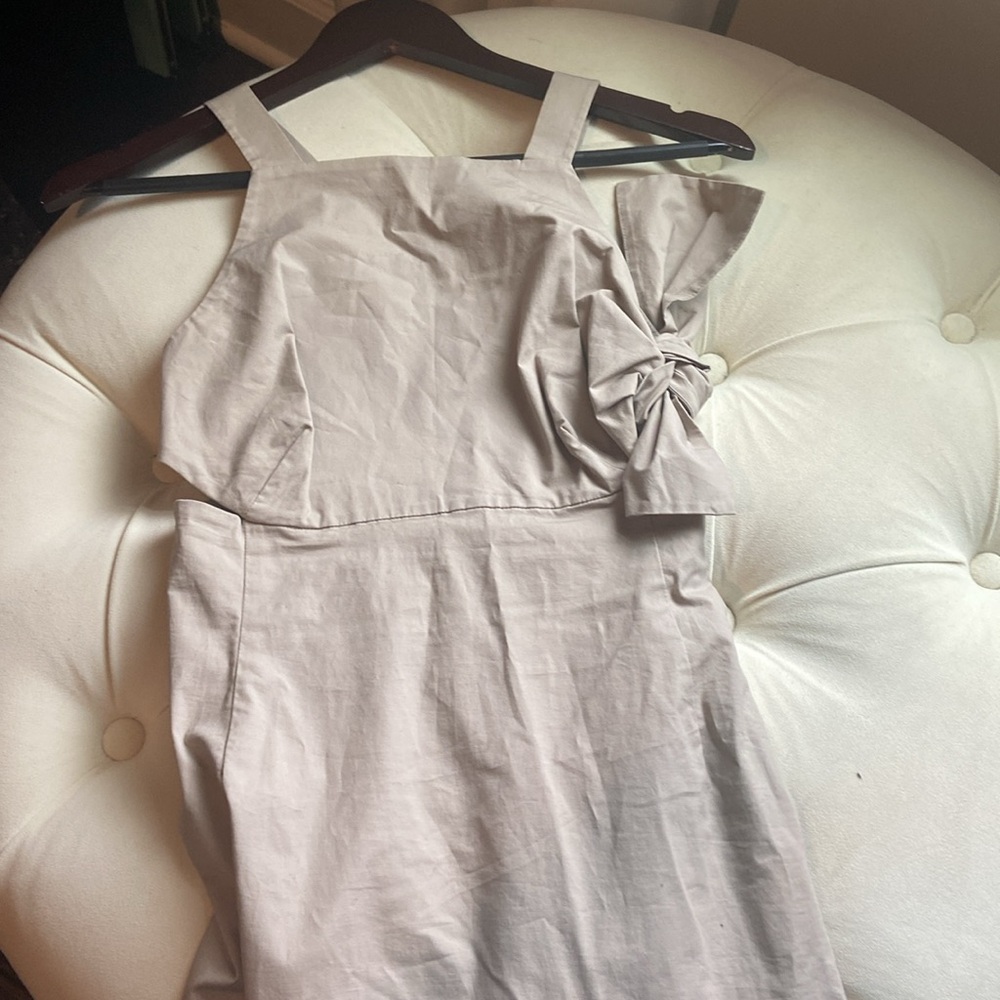 Kate Spate SATURDAY dress, has side cut outs and a signature bow on the side